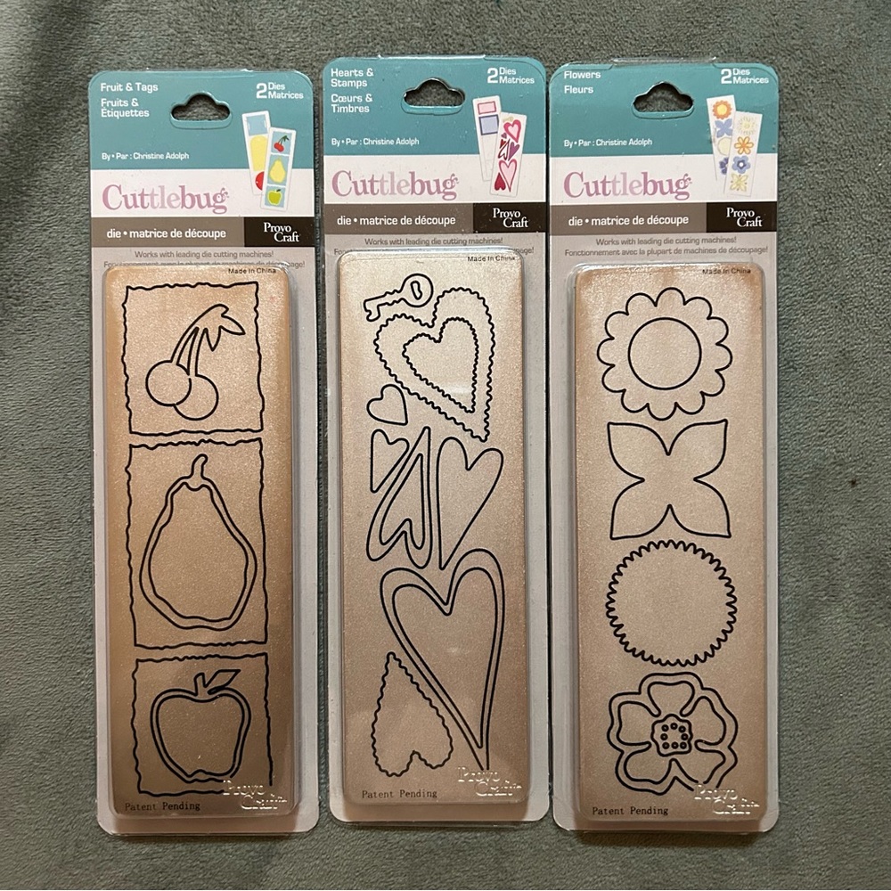 Lot of 3 cuttlebug 2” x 6” dies (fruit & tags, hearts & stamps, flowers)